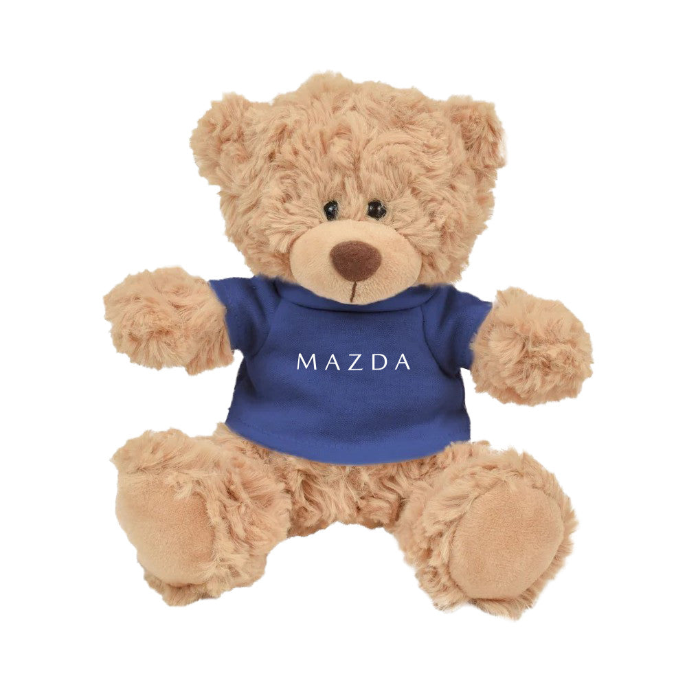 Teddy bear wearing a blue Mazda shirt on a white background