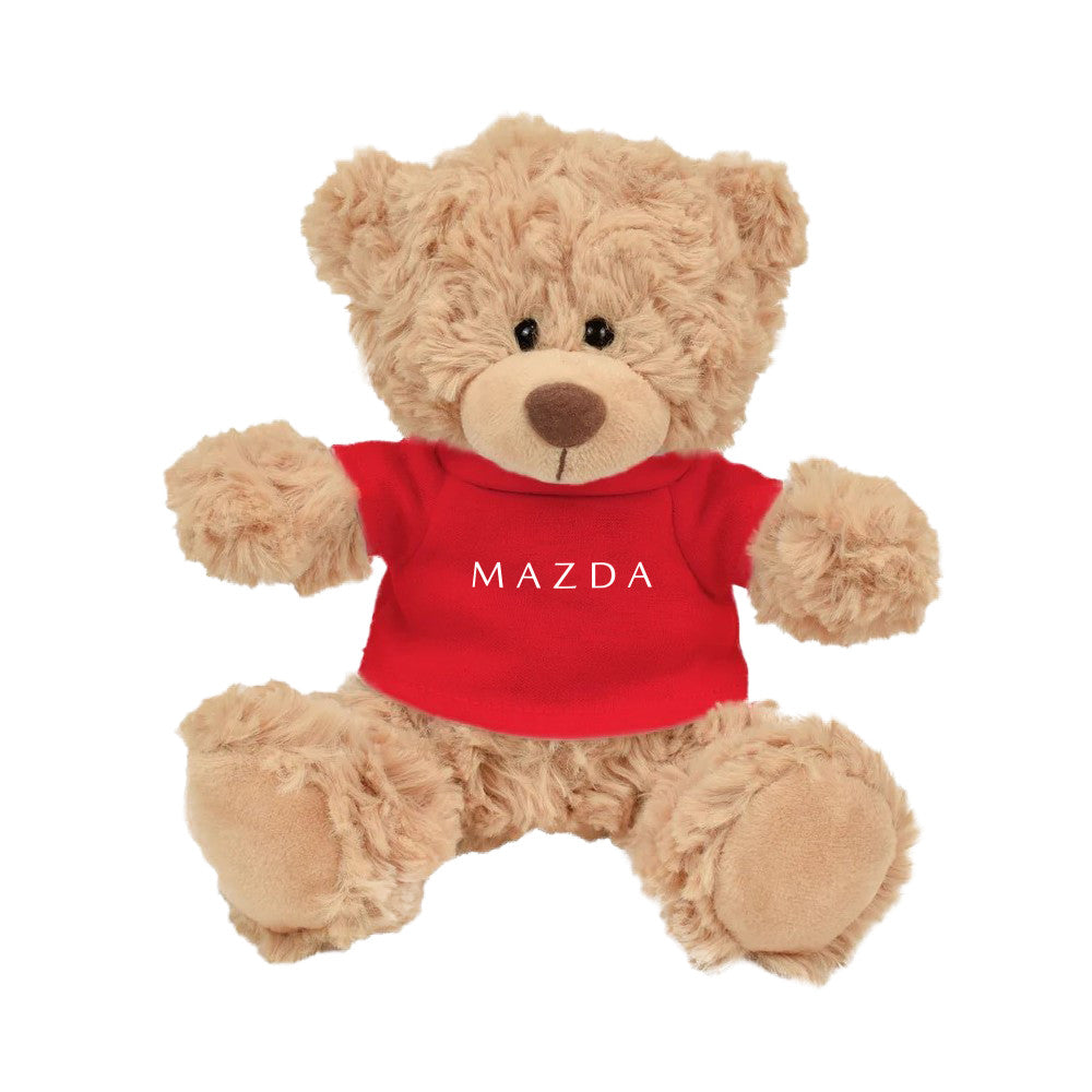 Teddy bear wearing a red Mazda shirt on a white background