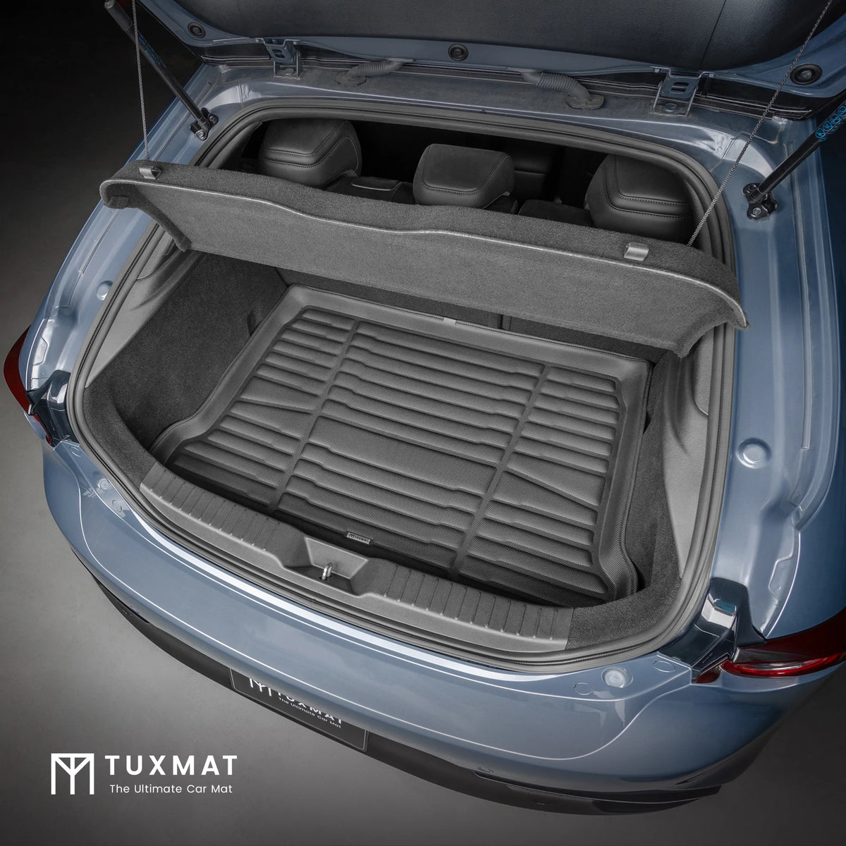 Car trunk with TuxMat cargo liner on a dark background