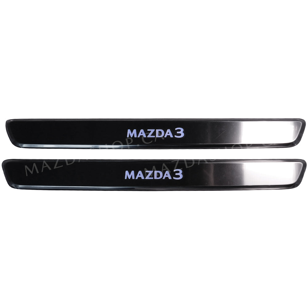 Two metallic car door sill protectors with 'MAZDA 3' branding on a white background.
