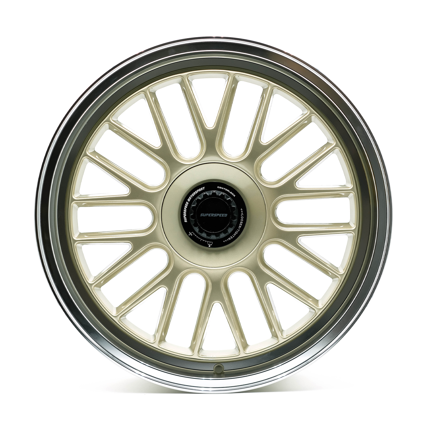 Car wheel rim with gold finish and black center on a white background