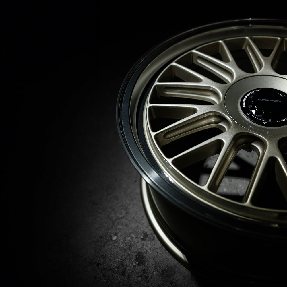 Close-up of a car wheel rim on a dark background