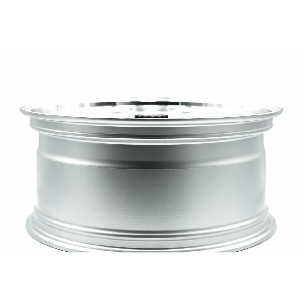 Silver alloy wheel on a white background